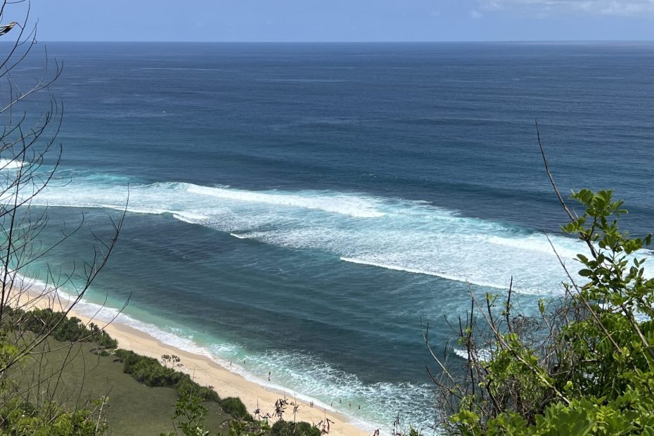 Travel photo of Nyang Nyang beach waves on a sunny day in Uluwatu, Bali.
