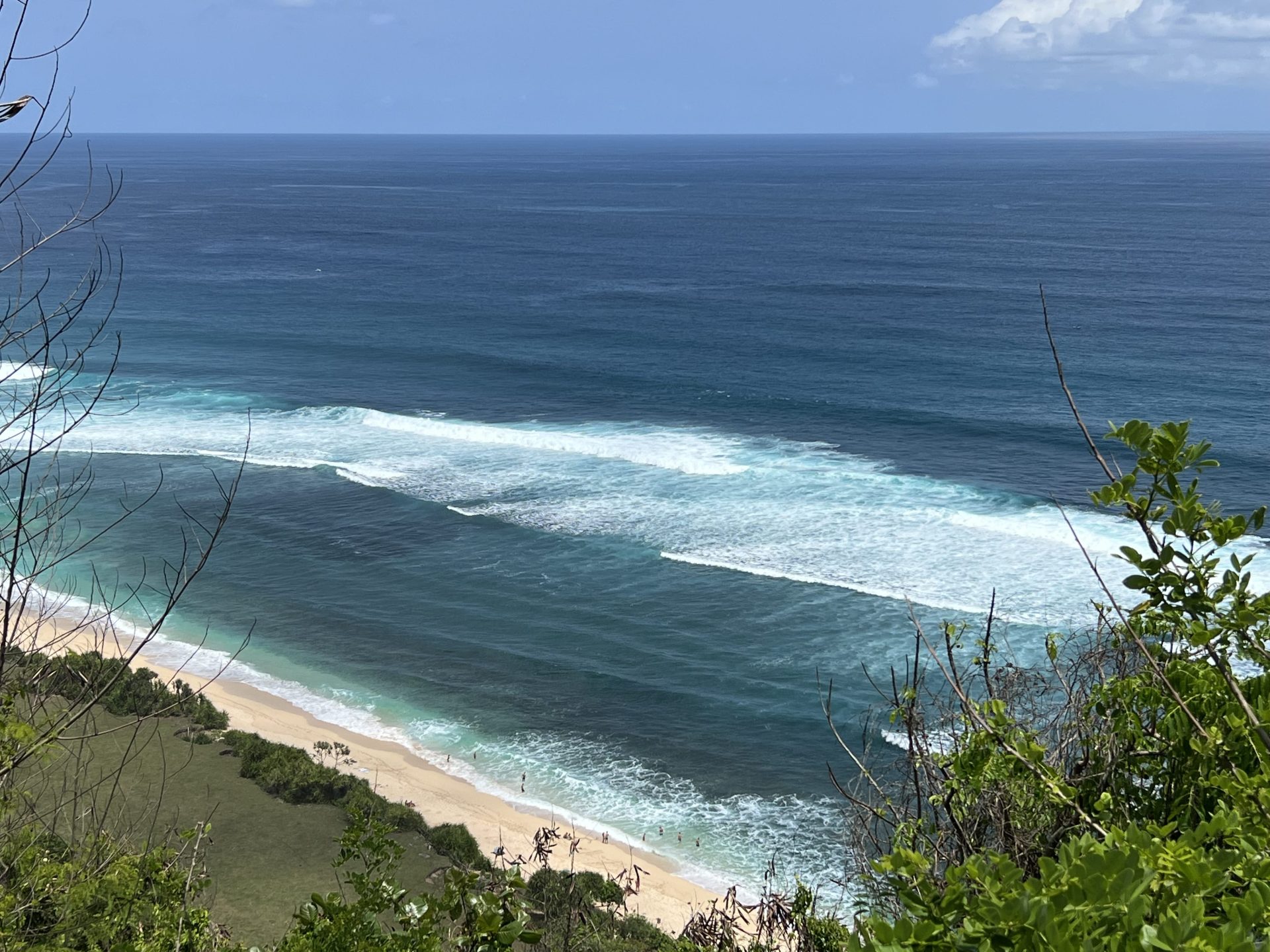 Travel photo of Nyang Nyang beach waves on a sunny day in Uluwatu, Bali.