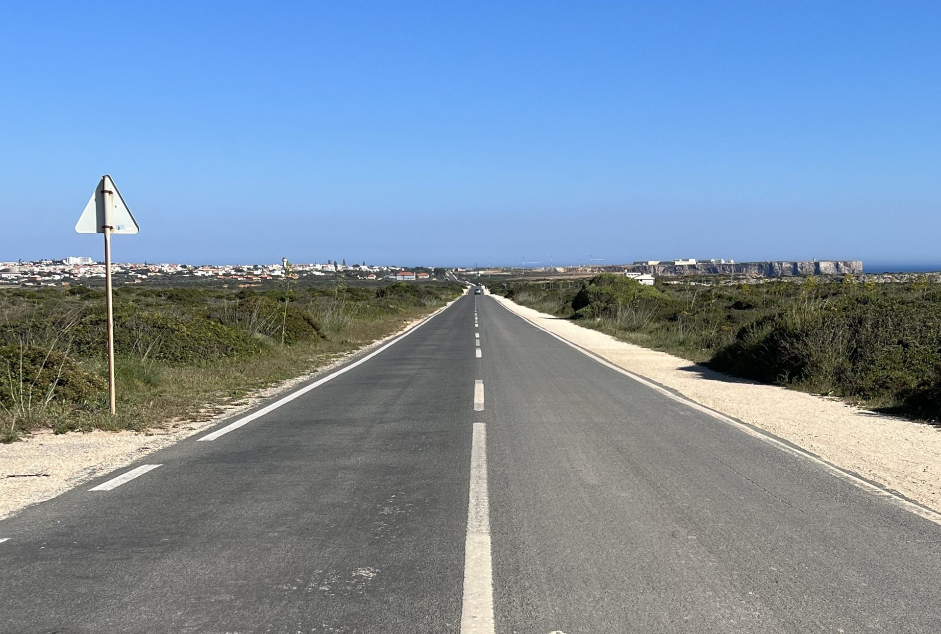 Photo of a timeless, basic straight track going all the way to the horizon.