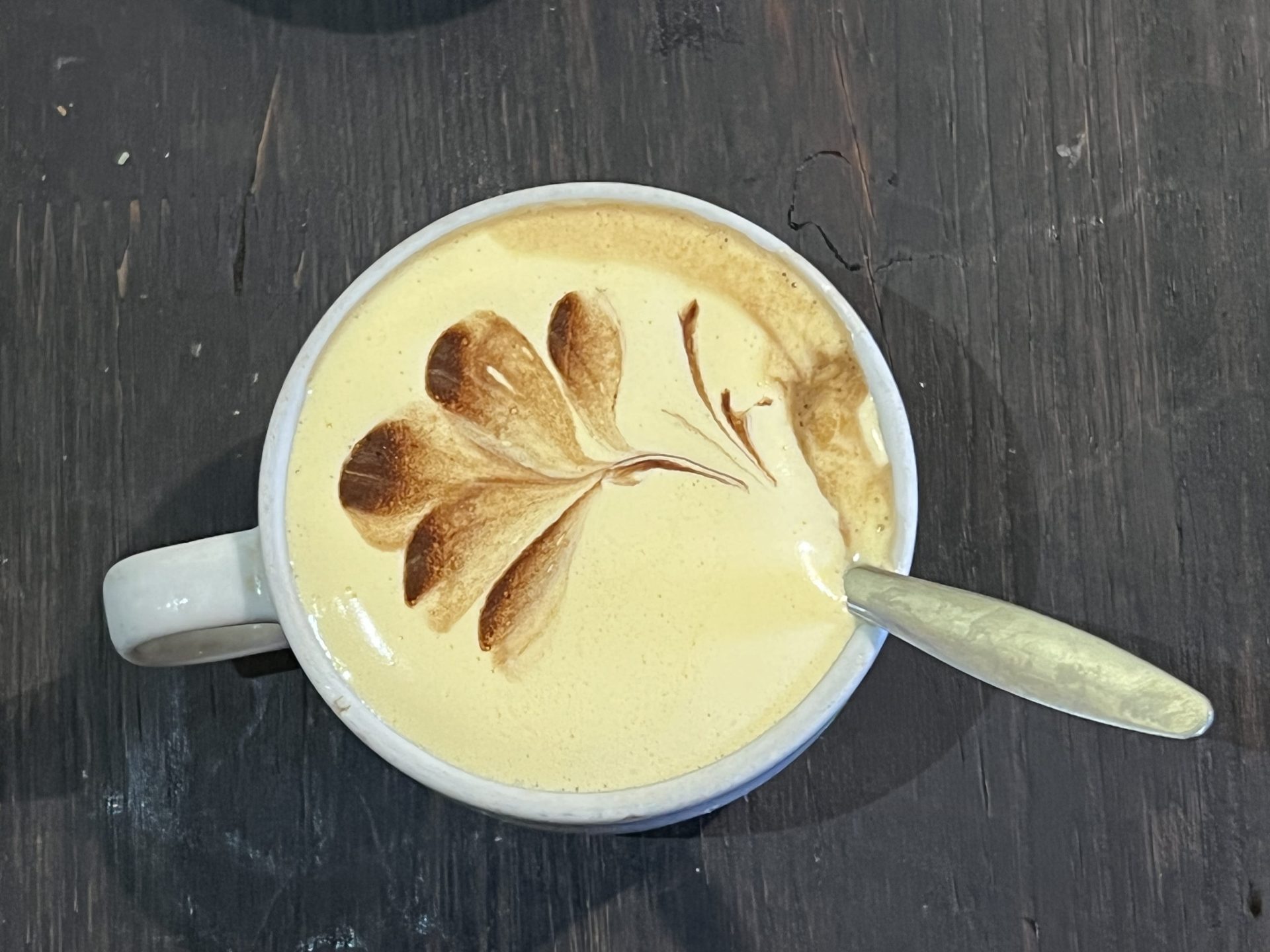 Arty photo of a Vietnamese egg coffee from above.