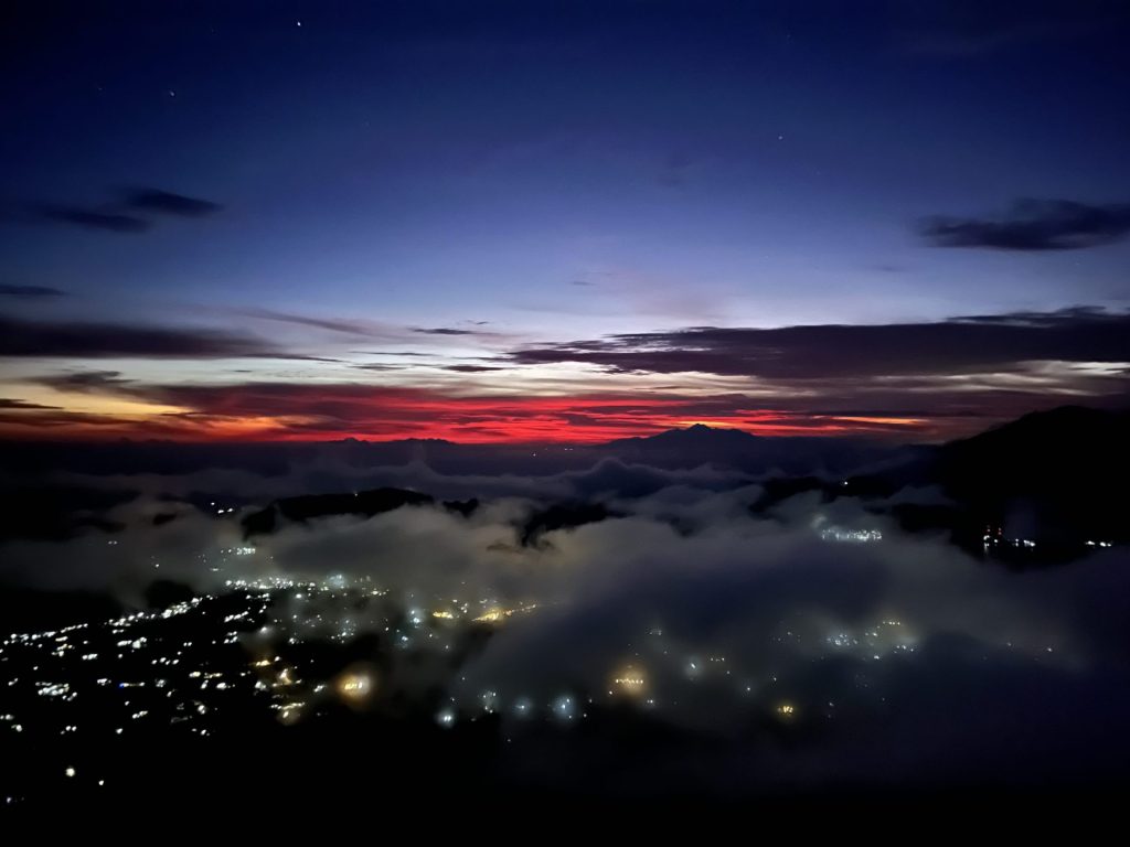 Travel photo from the Mount Batur Sunrise Trek showing deep red colours in the sky before the sun rises.
